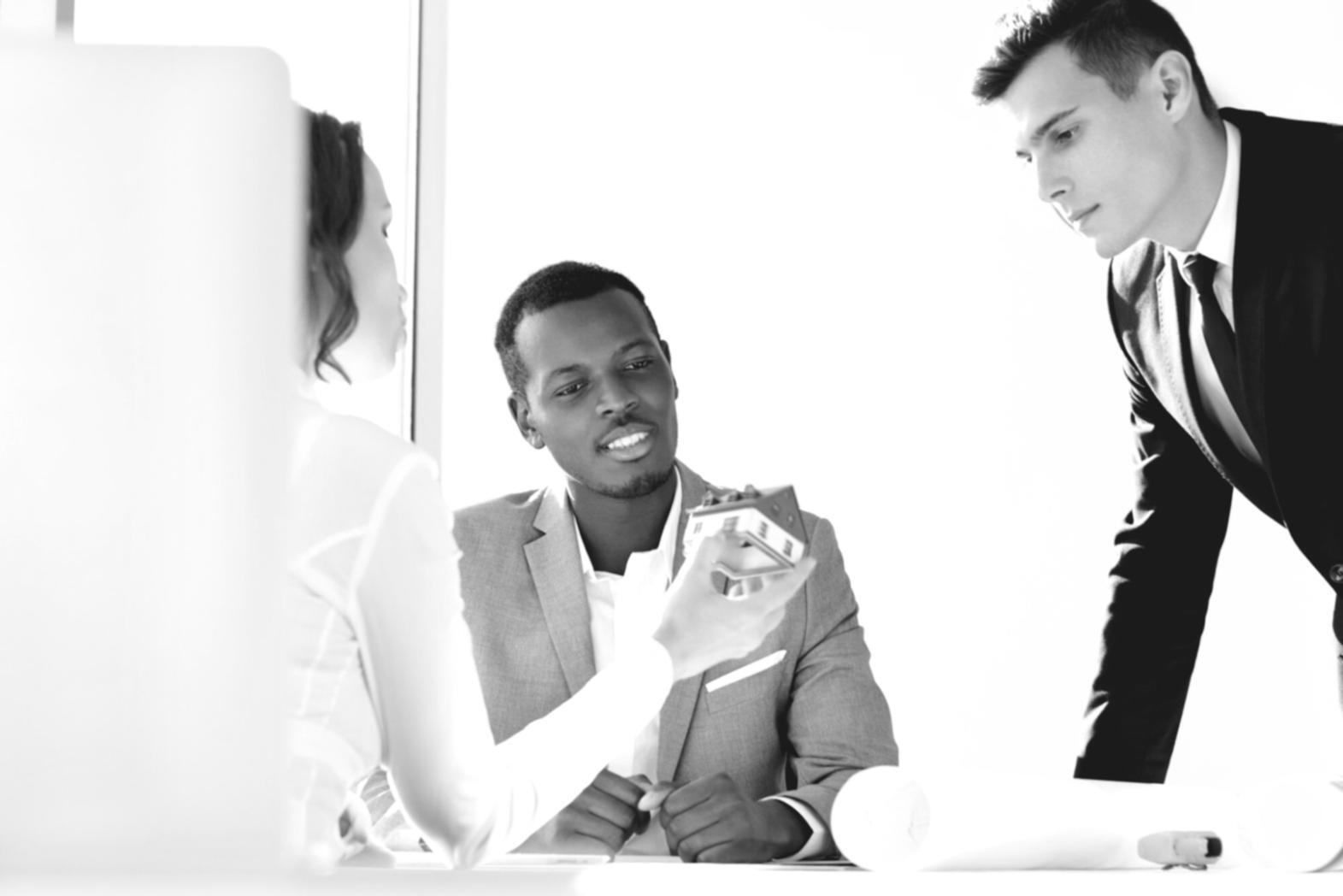 Detailed financial spreadsheets and variance analysis reports being reviewed